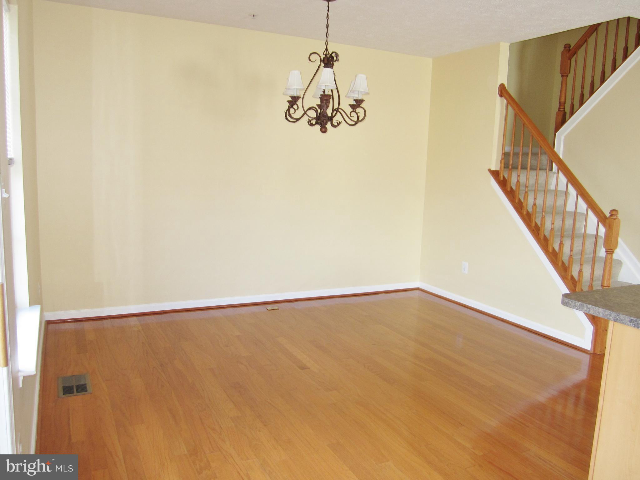 829 Lowe Road Baltimore, MD 21220 - Photo 10 of 28 a view of an empty room with chandelier fan