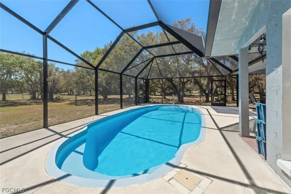 a view of a swimming pool with a porch