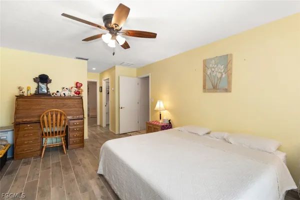 a bed room with a bed and a chandelier