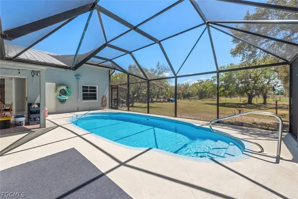 a room with a bed and a large window
