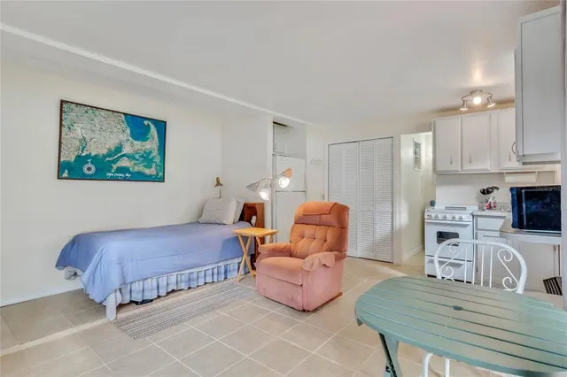 a bedroom with a bed and furniture