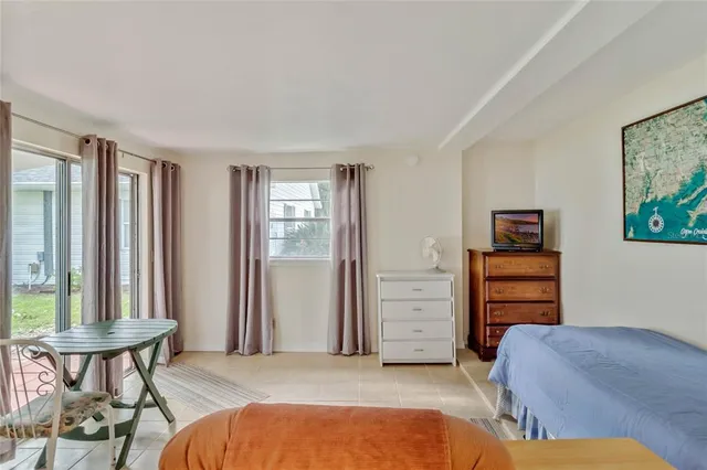 a bedroom with a bed and furniture