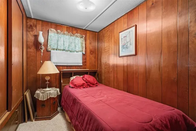 a view of a porch with chairs and backyard