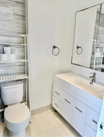 a bathroom with a toilet and a sink