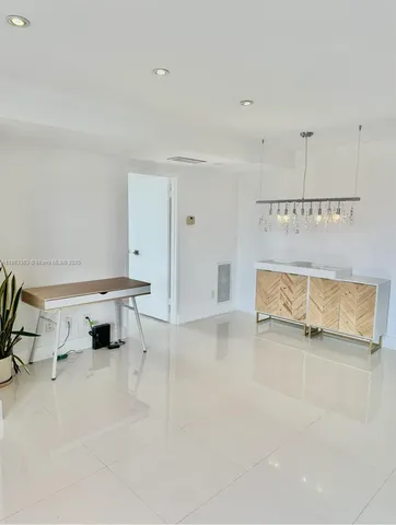 a view of a livingroom with furniture and a rug