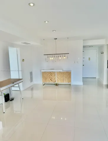 a view of a kitchen with a sink and a window