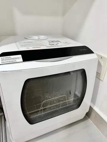 a utility room with washing machine