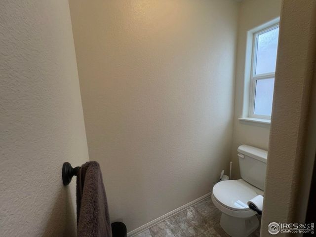 a bathroom with a double vanity sink a mirror and a bathtub