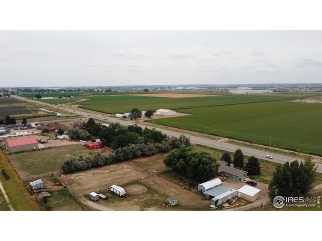an aerial view of a house with a ocean view