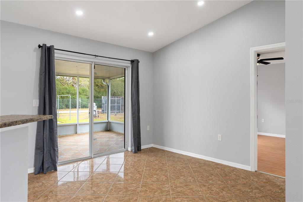 17168 Southwest 39th Circle Ocala, FL 34473 - Photo 14 of 36 a view of an empty room with glass door