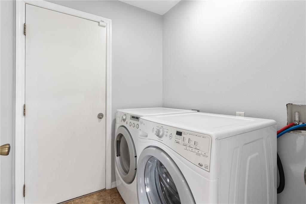 17168 Southwest 39th Circle Ocala, FL 34473 - Photo 17 of 36 a utility room with dryer and washer