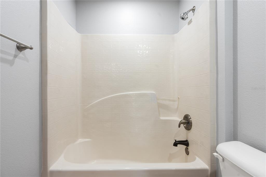 17168 Southwest 39th Circle Ocala, FL 34473 - Photo 21 of 36 a bathroom with a bathtub