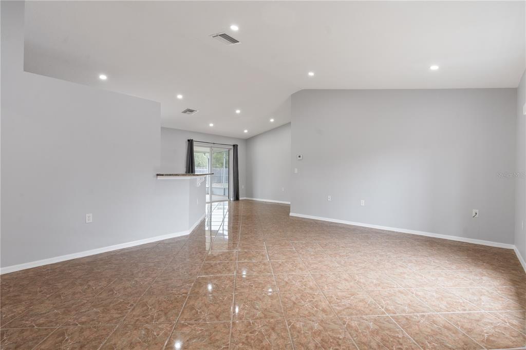 17168 Southwest 39th Circle Ocala, FL 34473 - Photo 4 of 36 a view of empty room with wooden floor