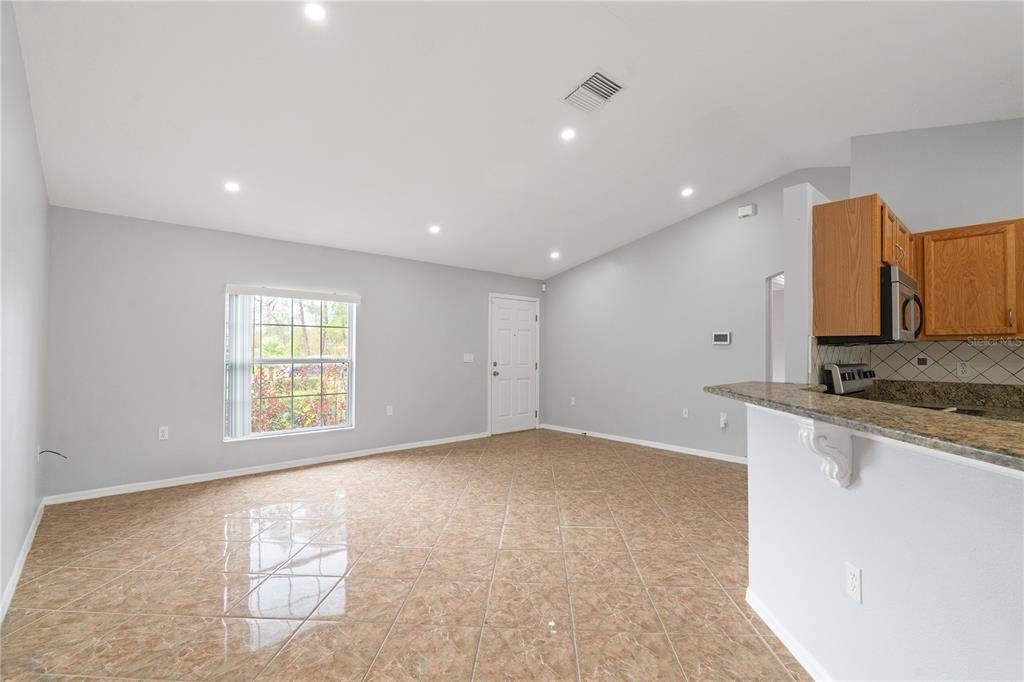 17168 Southwest 39th Circle Ocala, FL 34473 - Photo 6 of 36 a view of a kitchen with a sink a window and appliances