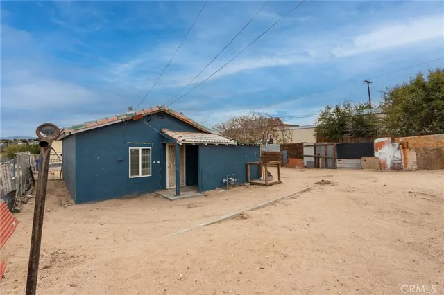 a view of a house with a snow in the yard