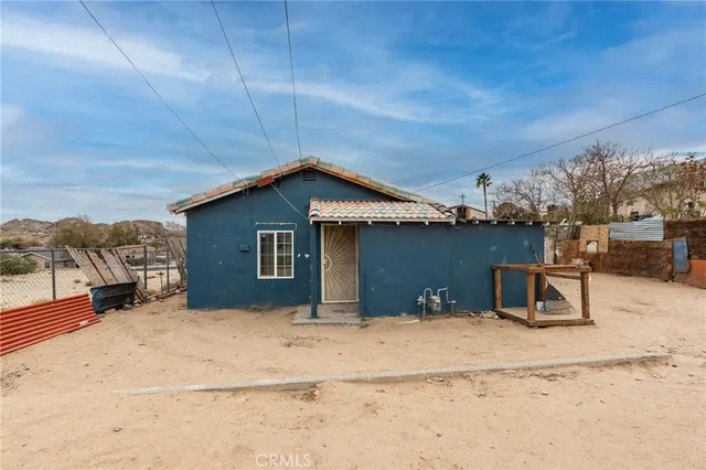 a dining room with furniture and a window