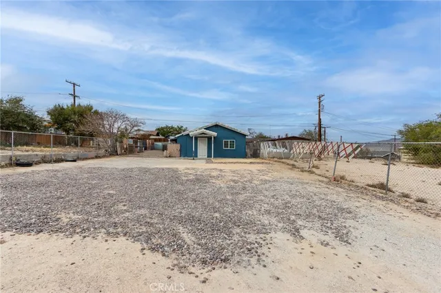 a view of house with a yard
