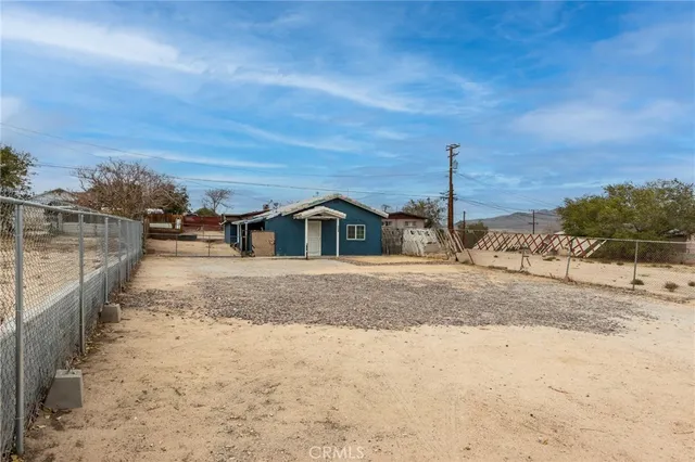 a view of a house with a snow in the yard