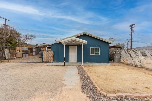 a kitchen with stainless steel appliances a refrigerator and a stove top oven