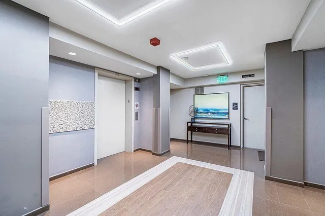 a view of workspace with wooden floor and furniture