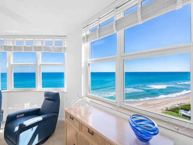 a view of porch with a chair and potted plant