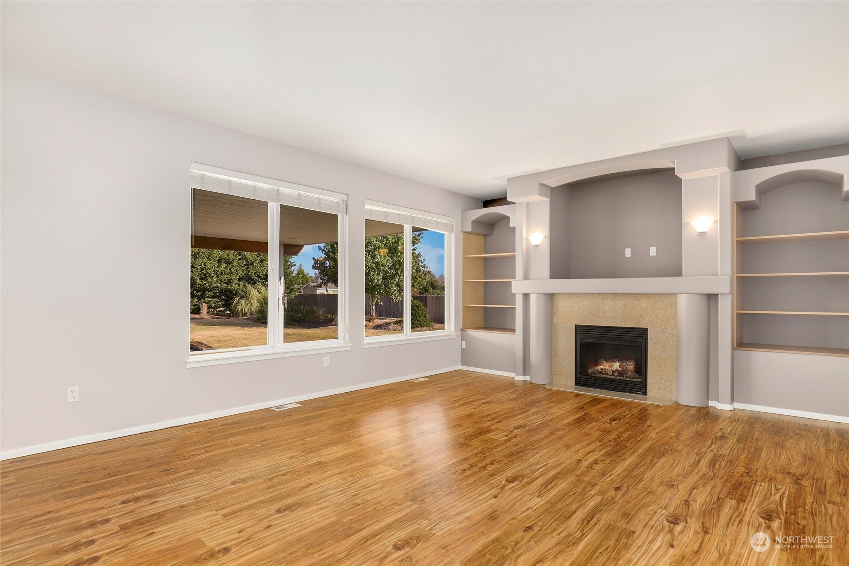 4633 181st Lane Southwest Rochester, WA 98579 - Photo 16 of 40 a view of an empty room with a fireplace and a window