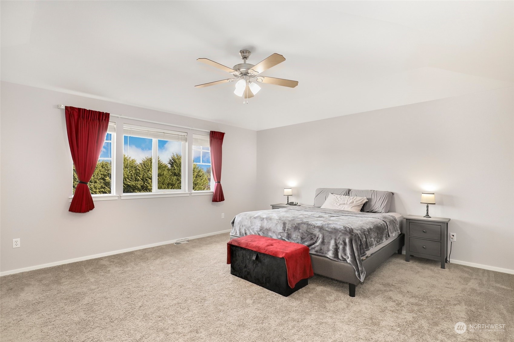 4633 181st Lane Southwest Rochester, WA 98579 - Photo 21 of 40 a bedroom with a bed and a chandelier