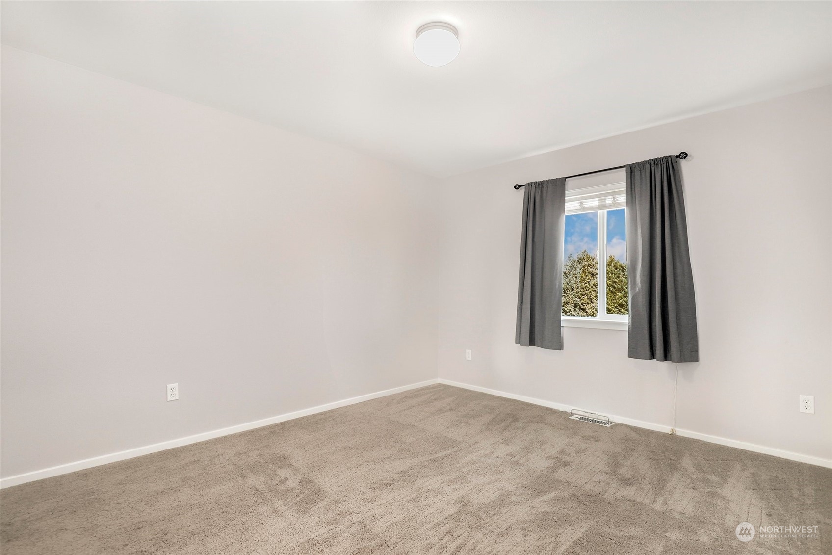 4633 181st Lane Southwest Rochester, WA 98579 - Photo 28 of 40 a view of an empty room with a window