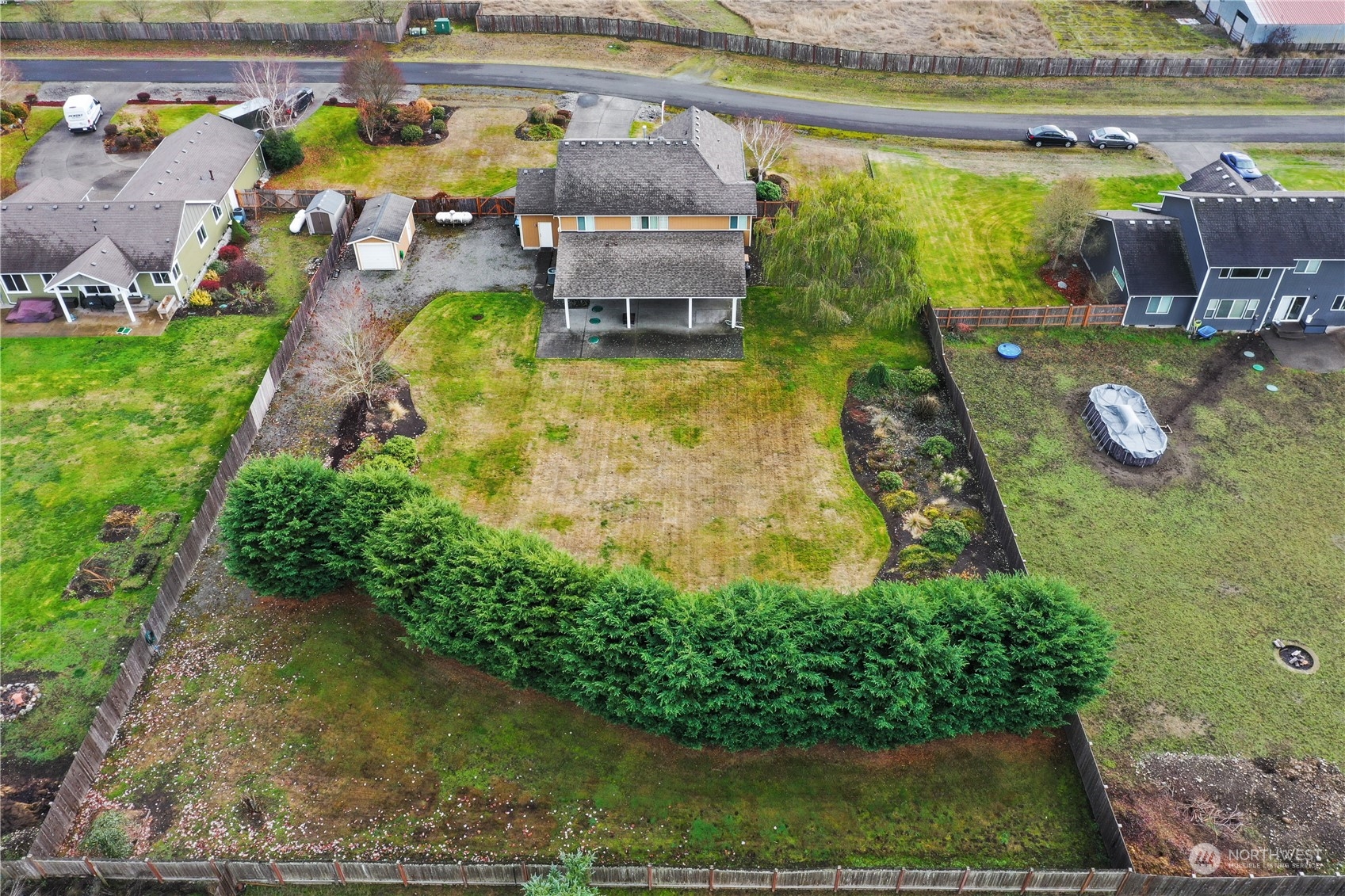 4633 181st Lane Southwest Rochester, WA 98579 - Photo 39 of 40 a aerial view of a house with outdoor space swimming pool and outdoor seating
