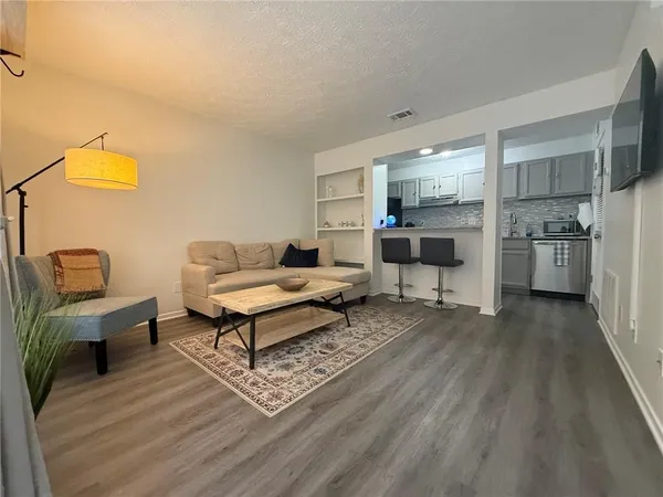 a living room with furniture and a table