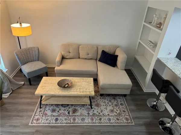 a living room with furniture and a rug