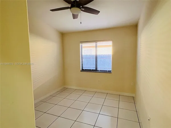 a view of an empty room and window