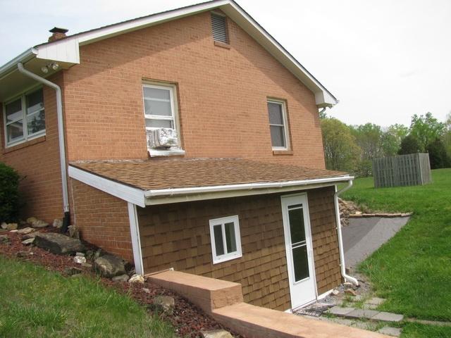 2668 Quarles Road Thaxton, VA 24174 - Photo 14 of 21 a front view of a house with a yard