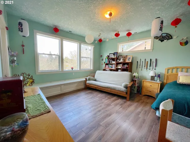 a bedroom with furniture and a window