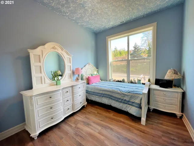 a bedroom with a bed and a dresser