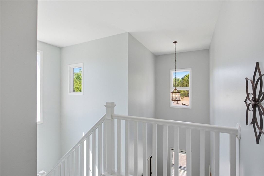 578 Sunset Point Drive West Union, SC 29696 - Photo 15 of 46 Sun-drenched stairwell with bright windows illuminates the inviting multi-level interior.