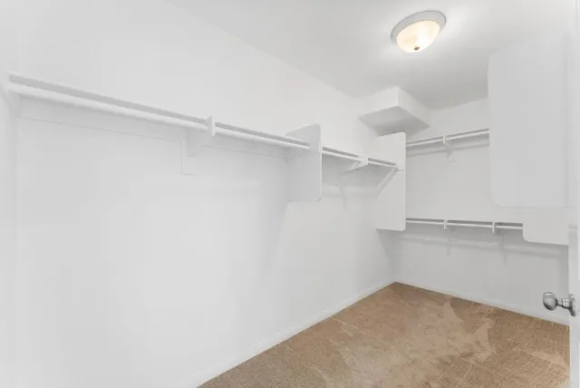 a view of an empty walk in closet
