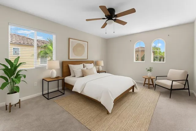 a bedroom with furniture and windows
