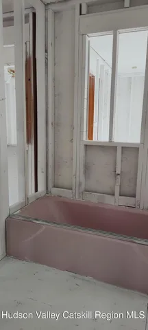 a view of a closet area with windows