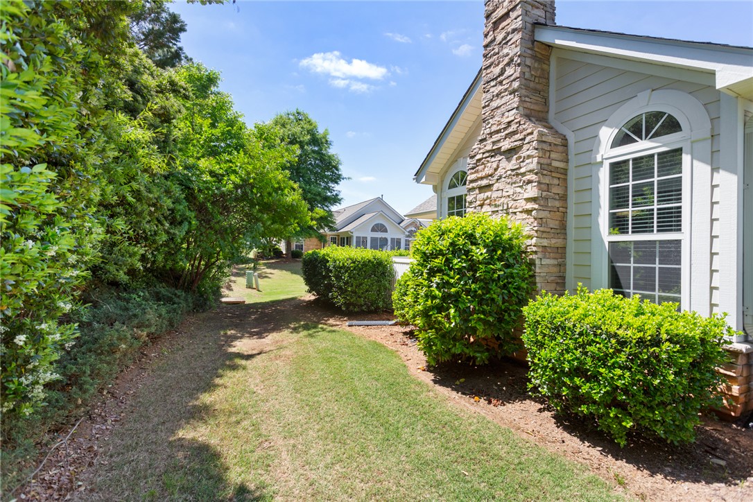 155 Life Style Lane Anderson, SC 29621 - Photo 37 of 49 This charming home offers a well-maintained yard and architectural details, blending comfort with classic appeal.