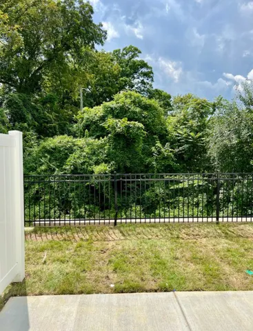 a view of swimming pool with a yard