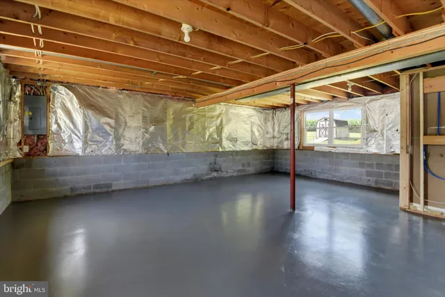 a view of room with wooden floor