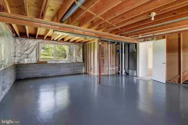 a view of room with window and wooden floor