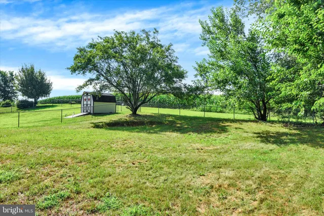 a view of a house with a big yard