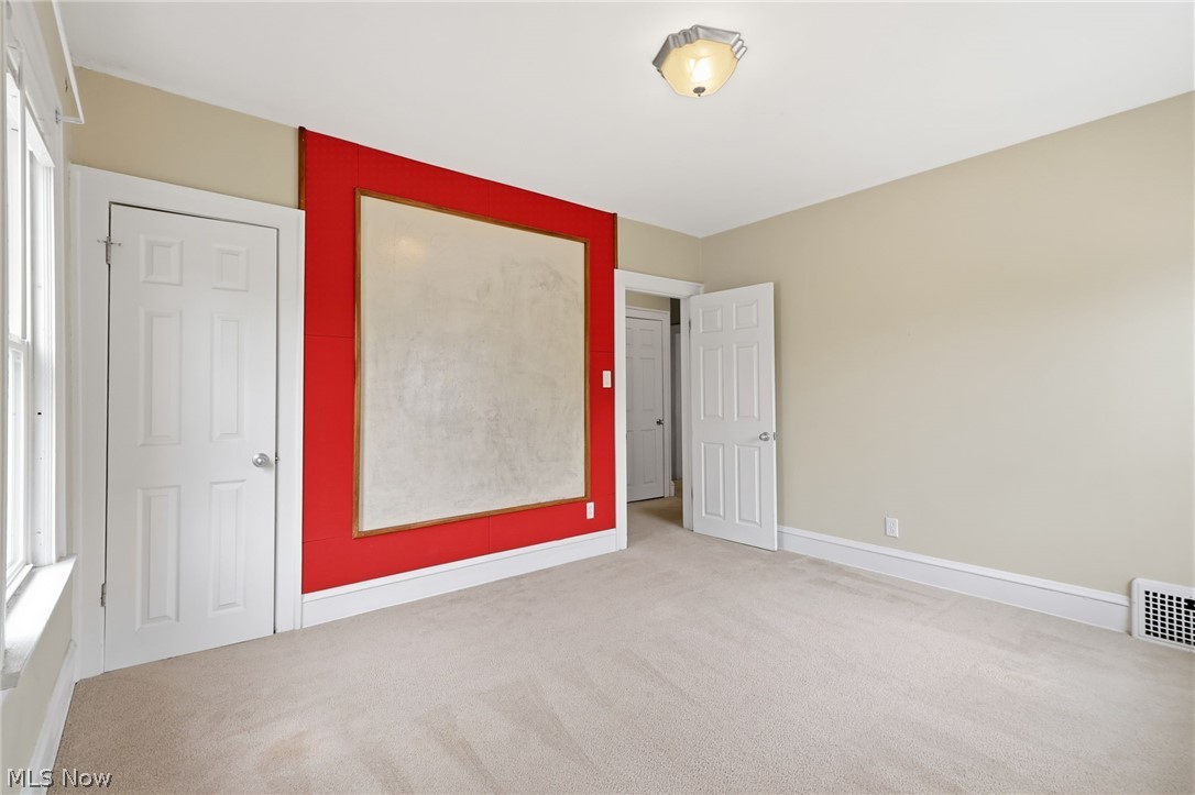 3511 Northcliffe Road Cleveland, OH 44118 - Photo 27 of 46 Wall-to-wall carpeting, window with trim, painted interior doors, and a ceiling-mounted light fixture