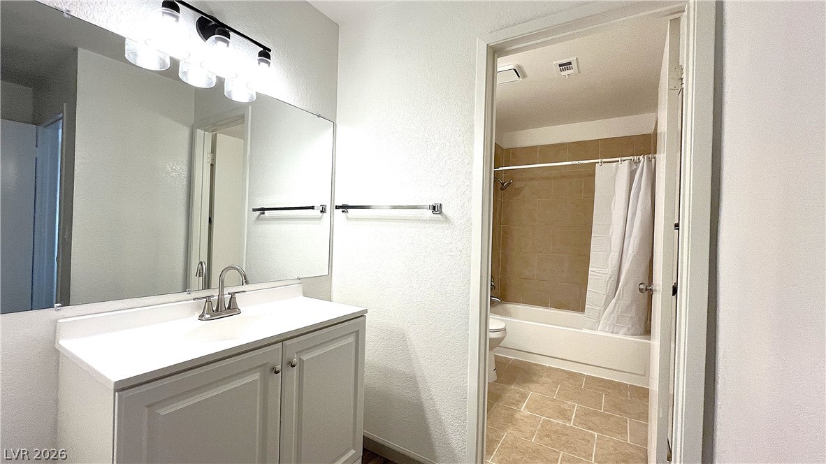 6750 Del Rey Avenue, Unit 123 Las Vegas, NV 89146 - Photo 14 of 21 Bright and clean bathroom with a pristine vanity and well-appointed bath.