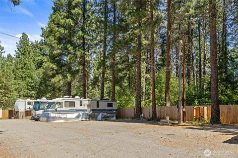 a swimming pool with an outdoor space and seating area