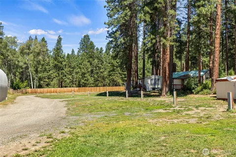 a view of a yard with a trampoline