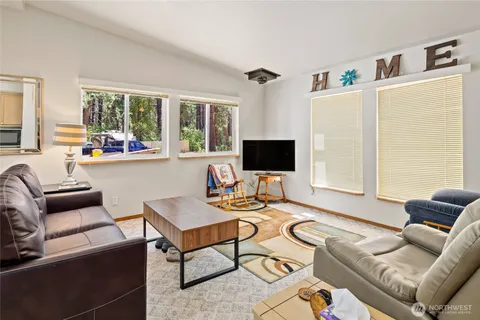 a kitchen with a stove a table and chairs