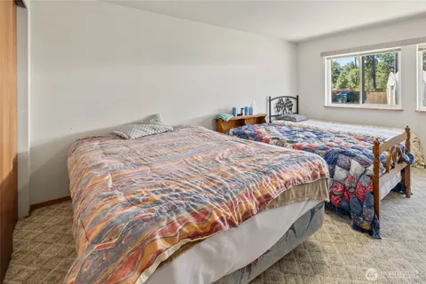 a bathroom with a double vanity sink toilet and shower